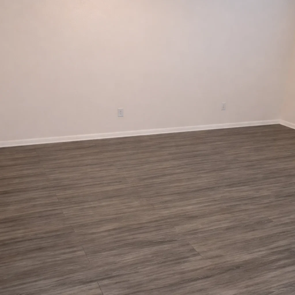 Modern wood-style flooring and fresh white walls inside the La Villa Elms Apartments living space.